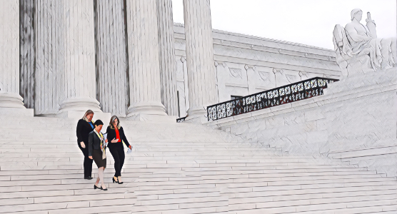 Three women walking down the white marble steps of the Supreme Court building